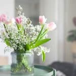 white and pink flowers in clear glass vase