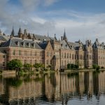 A large building sitting next to a body of water