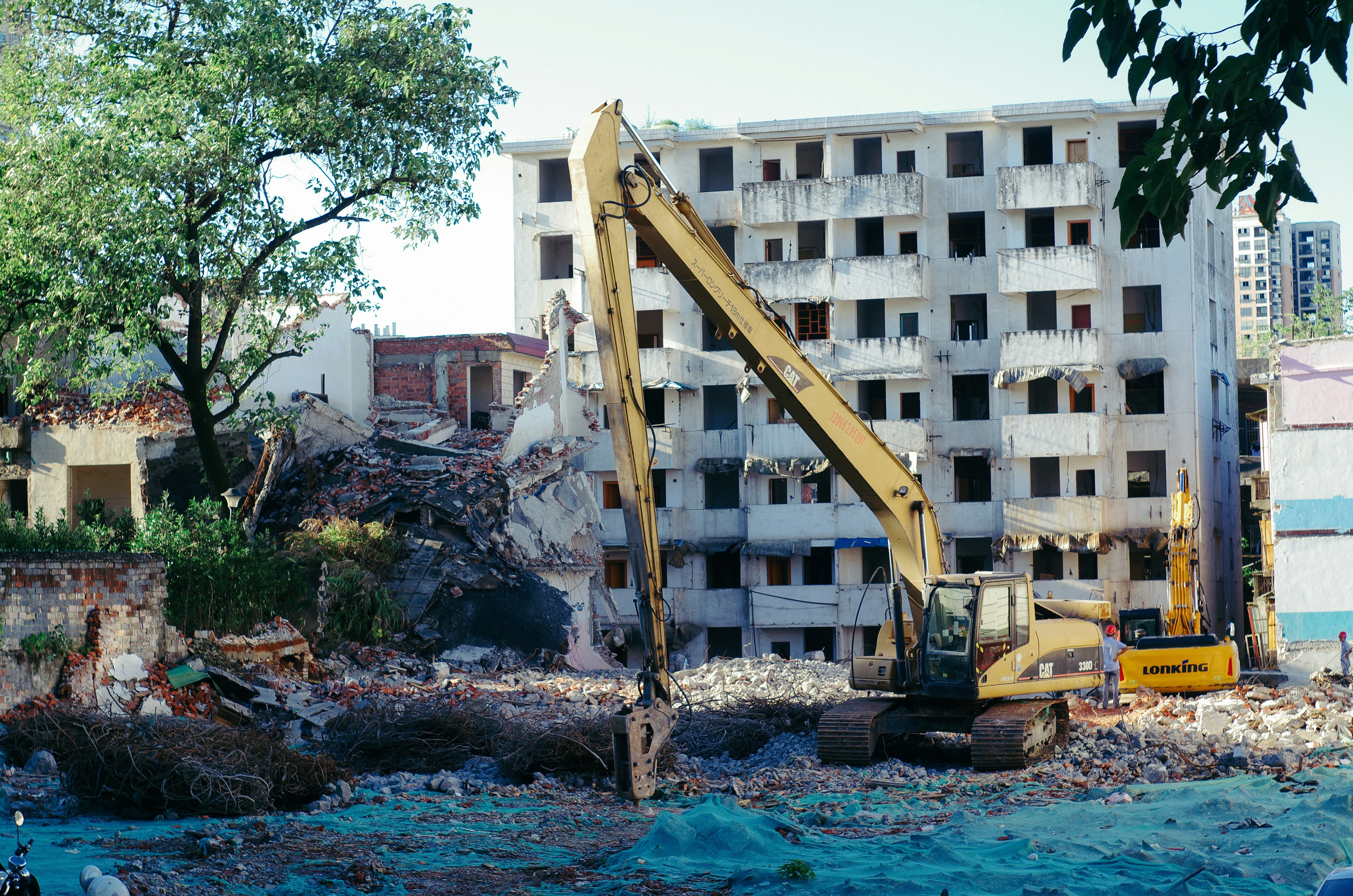 a construction site with a crane in the foreground