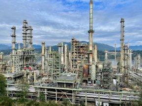 A large industrial area with a lot of tall buildings