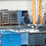 A man working on a machine in a factory