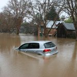 a car driving through a flooded street