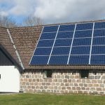 a house with a solar panel on the roof