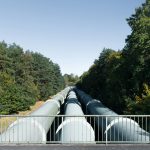 A large pipe on the side of a road