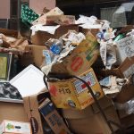 A messy pile of cardboard boxes and assorted items.