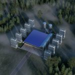 An aerial view of a building in the middle of a forest