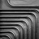 A black and white photo of a bunch of pipes