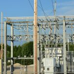 an electrical substation with power lines and wires