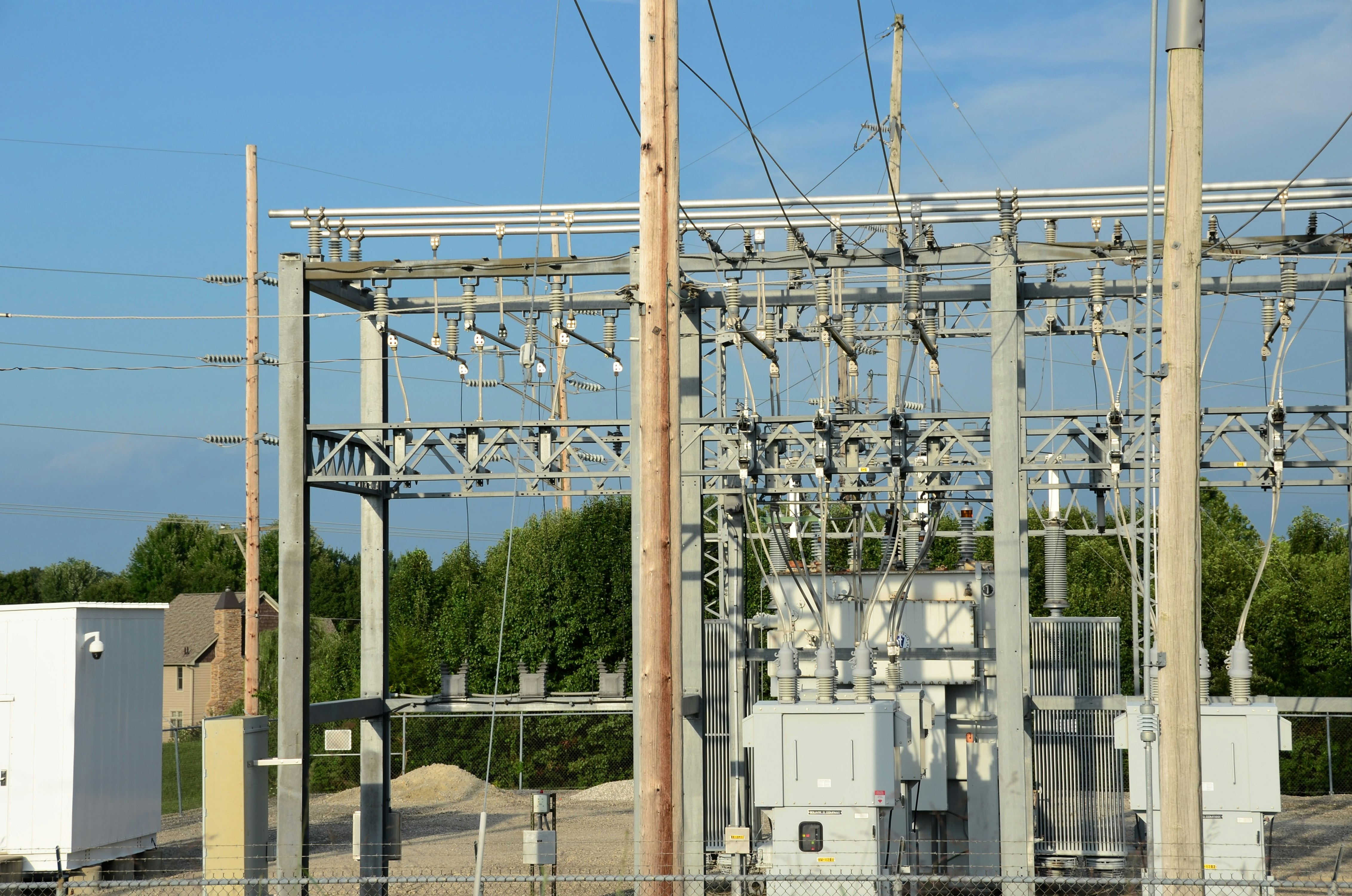 an electrical substation with power lines and wires