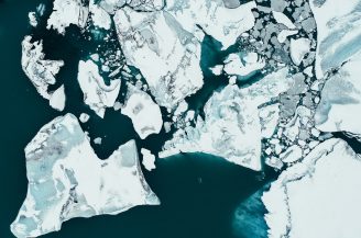 white ice on body of water during daytime