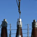 a group of towers with wires
