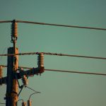 three electric cables on electric post