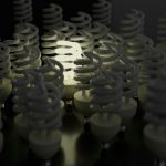 a group of light bulbs with a black background